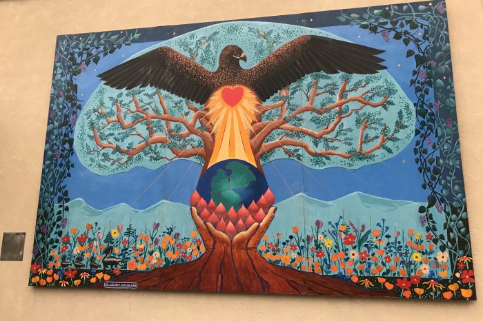 Colorful mural depicting a bird rising out of the limbs of a tree to symbolize the City of Willits urban forest